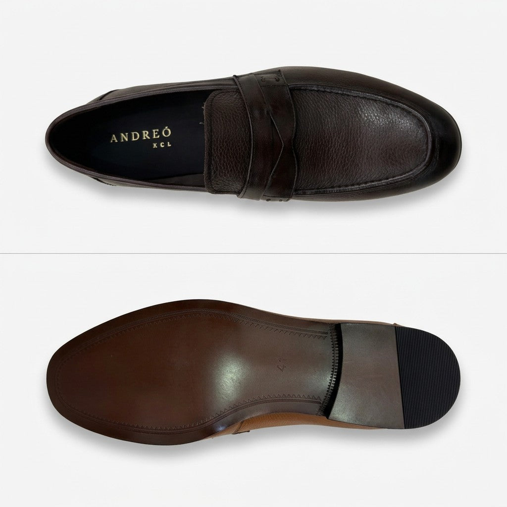 A dark brown leather penny loafer shown from two angles: a top-down view displaying the interior with the brand name 'ANDREÍ O KCL' in gold, and a bottom-down view showing the sole with a black rubber heel cap, set against a clean white background.