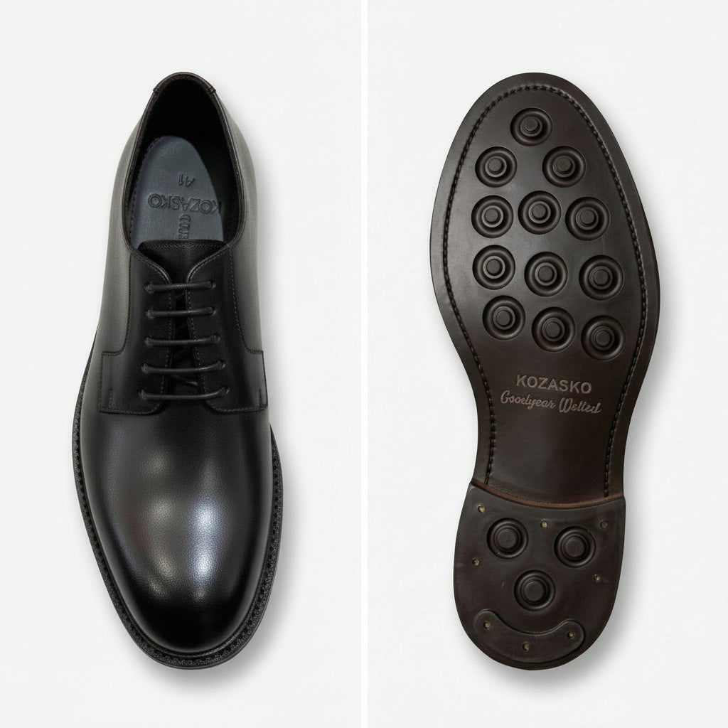 A pair of black leather dress shoes shown from the top and sole views on a light gray background. The brand name 'Kozasko' is visible on the insole and printed on the outsole.