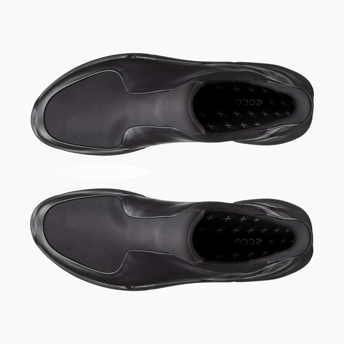 A pair of black slip-on sneakers shown from a top-down view on a light gray background, displaying the textured upper, sole, and the 'ecco' brand name on the insole.