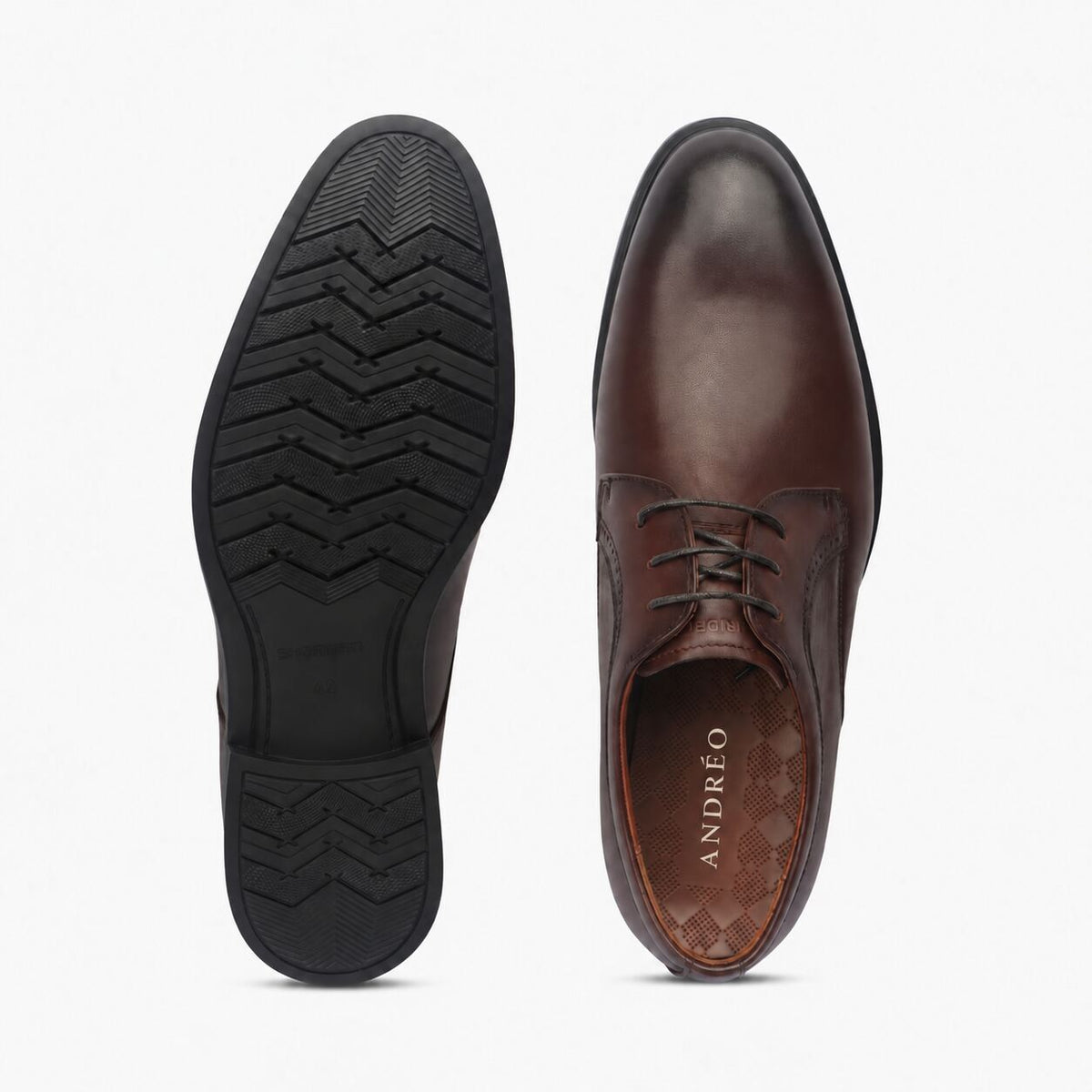 A pair of men's brown leather dress shoes shown from the top and side, with the outsole of the left shoe visible against a clean white background. The brand name 'ANDREO' is printed on the inner sole.