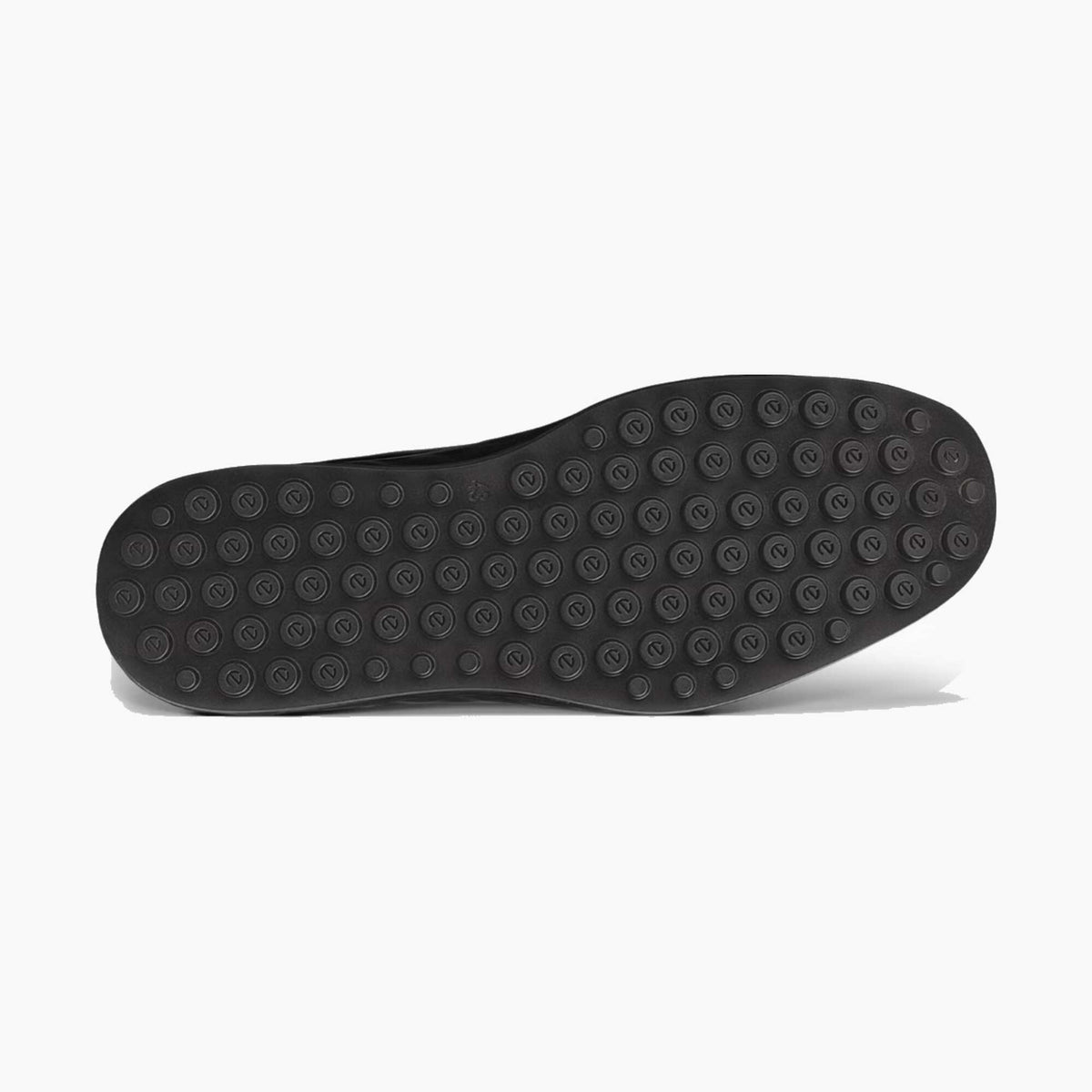 Black shoe sole with tread pattern on a light gray background