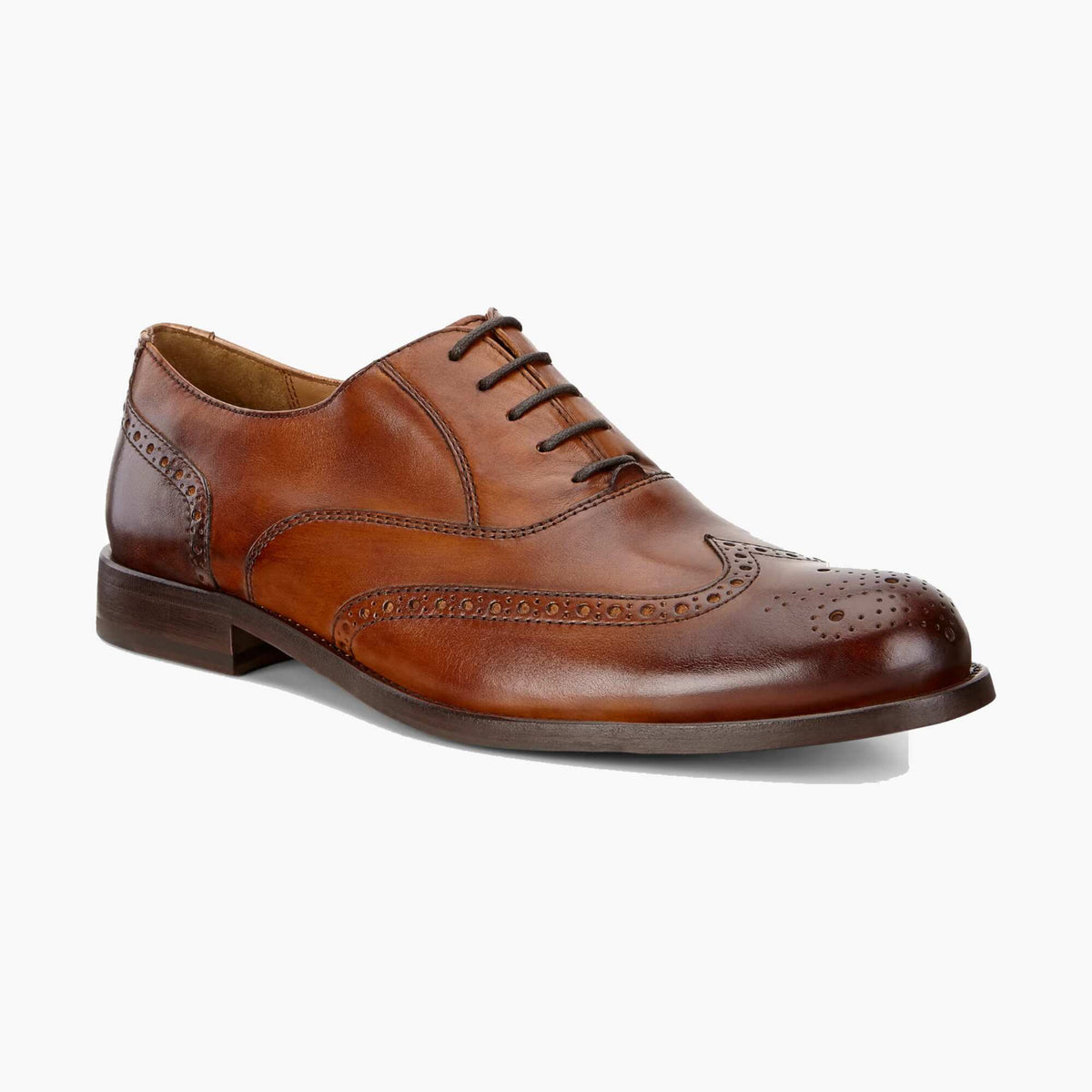 A classic brown leather wingtip oxford shoe with brogue detailing, shown from a three-quarters angle on a clean white background.