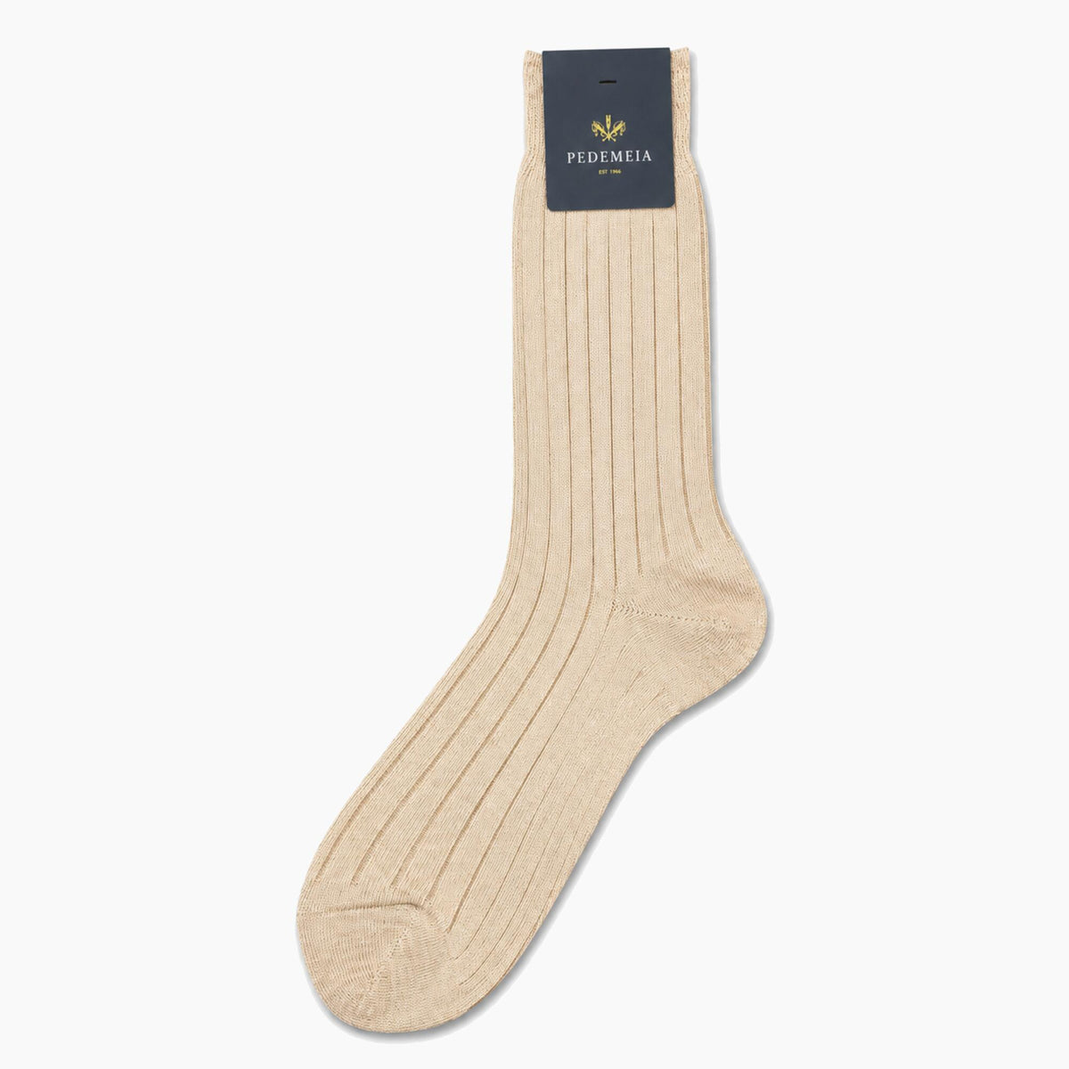 A single ribbed knit crew sock in a light beige color, shown against a plain white background with its dark navy brand tag attached at the cuff.
